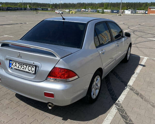 Сірий Міцубісі Lancer, об'ємом двигуна 1.58 л та пробігом 273 тис. км за 4599 $, фото 3 на Automoto.ua