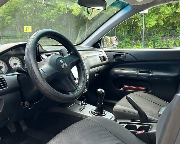 Сірий Міцубісі Lancer, об'ємом двигуна 1.58 л та пробігом 160 тис. км за 4600 $, фото 16 на Automoto.ua
