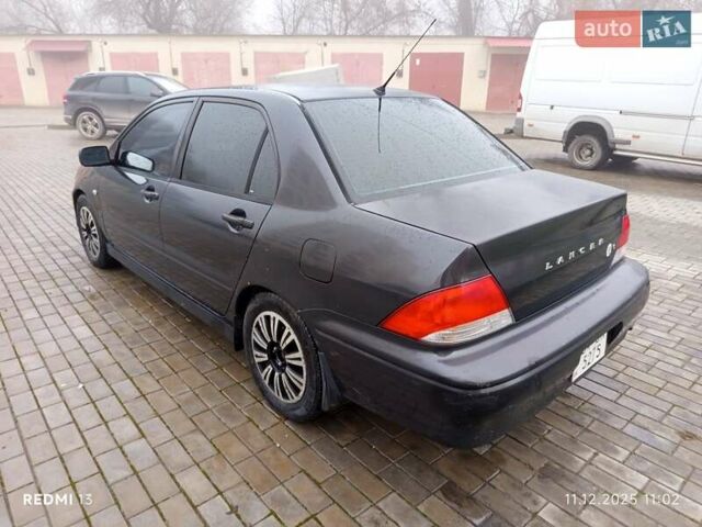 Серый Мицубиси Лансер, объемом двигателя 2 л и пробегом 215 тыс. км за 2900 $, фото 1 на Automoto.ua