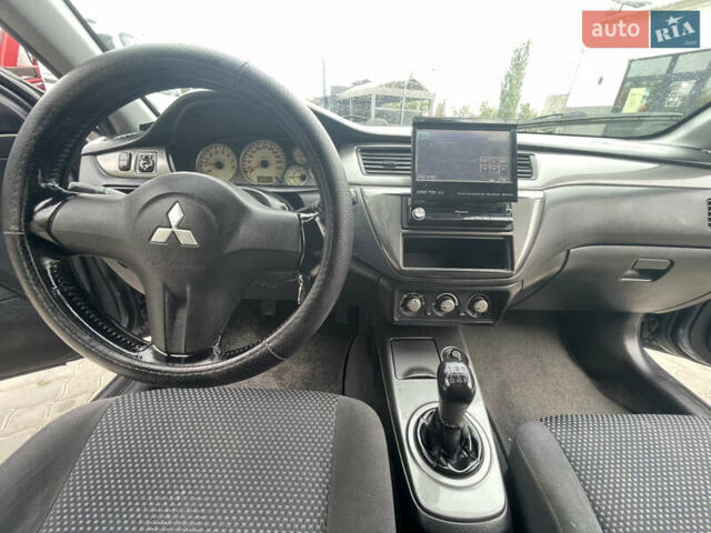 Сірий Міцубісі Lancer, об'ємом двигуна 1.58 л та пробігом 162 тис. км за 4650 $, фото 10 на Automoto.ua