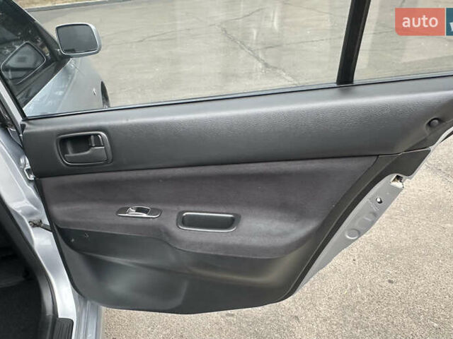 Серый Мицубиси Лансер, объемом двигателя 1.58 л и пробегом 183 тыс. км за 4800 $, фото 23 на Automoto.ua