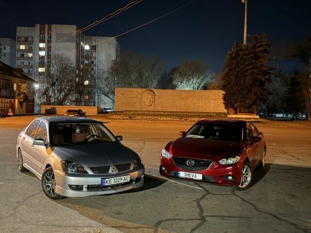 Серый Мицубиси Лансер, объемом двигателя 2 л и пробегом 256 тыс. км за 7000 $, фото 15 на Automoto.ua