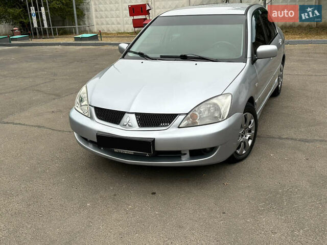 Серый Мицубиси Лансер, объемом двигателя 1.58 л и пробегом 183 тыс. км за 4800 $, фото 5 на Automoto.ua