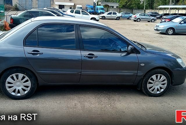 Серый Мицубиси Лансер, объемом двигателя 1.6 л и пробегом 275 тыс. км за 4700 $, фото 2 на Automoto.ua