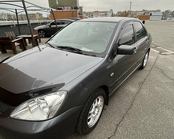 Сірий Міцубісі Lancer, об'ємом двигуна 1.6 л та пробігом 260 тис. км за 4998 $, фото 28 на Automoto.ua