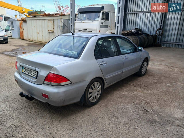 Серый Мицубиси Лансер, объемом двигателя 1.58 л и пробегом 215 тыс. км за 4000 $, фото 3 на Automoto.ua