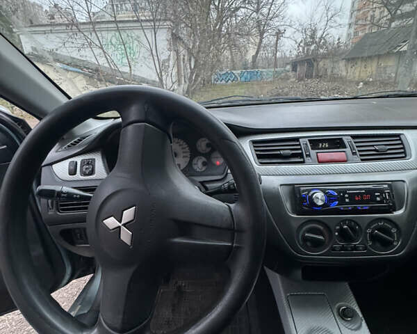 Сірий Міцубісі Lancer, об'ємом двигуна 1.6 л та пробігом 240 тис. км за 3000 $, фото 14 на Automoto.ua