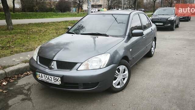 Серый Мицубиси Лансер, объемом двигателя 1.6 л и пробегом 263 тыс. км за 3650 $, фото 2 на Automoto.ua