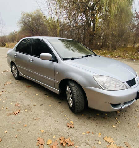 Серый Мицубиси Лансер, объемом двигателя 1.6 л и пробегом 253 тыс. км за 2850 $, фото 2 на Automoto.ua