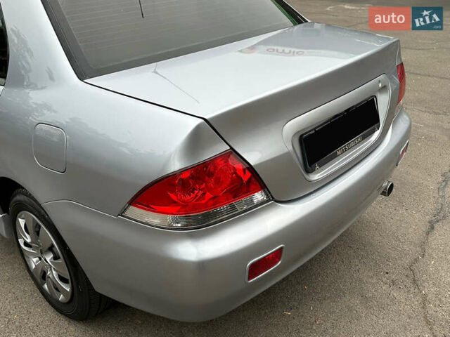 Серый Мицубиси Лансер, объемом двигателя 1.58 л и пробегом 183 тыс. км за 4800 $, фото 8 на Automoto.ua