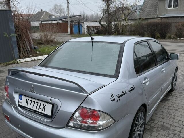 Серый Мицубиси Лансер, объемом двигателя 2 л и пробегом 256 тыс. км за 7000 $, фото 7 на Automoto.ua