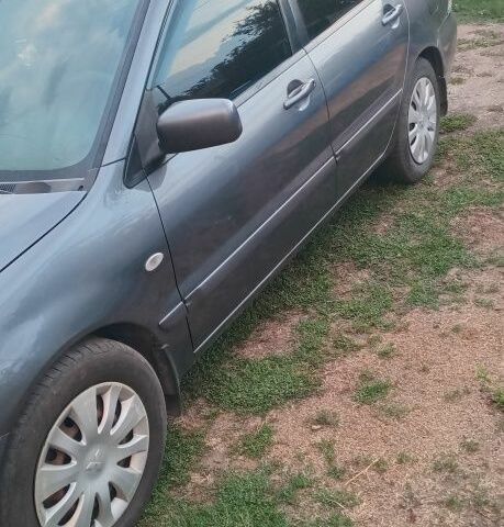 Серый Мицубиси Лансер, объемом двигателя 1.6 л и пробегом 270 тыс. км за 3700 $, фото 1 на Automoto.ua