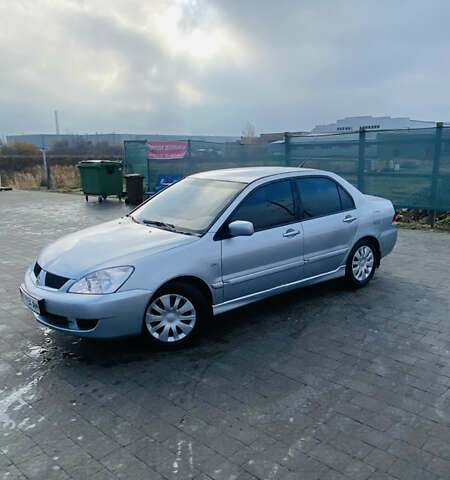 Серый Мицубиси Лансер, объемом двигателя 1.6 л и пробегом 253 тыс. км за 2850 $, фото 8 на Automoto.ua