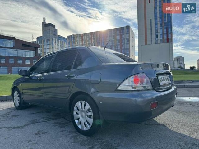 Сірий Міцубісі Lancer, об'ємом двигуна 1.58 л та пробігом 276 тис. км за 3650 $, фото 4 на Automoto.ua