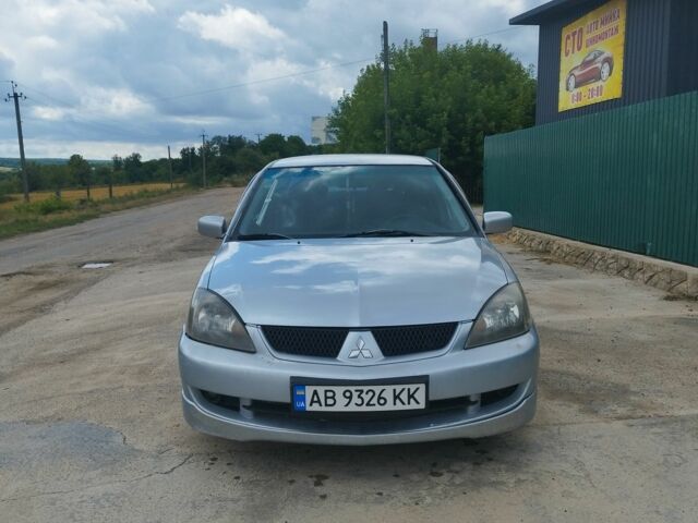 Серый Мицубиси Лансер, объемом двигателя 2 л и пробегом 306 тыс. км за 4100 $, фото 6 на Automoto.ua