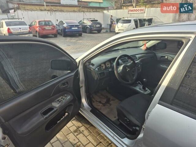 Серый Мицубиси Лансер, объемом двигателя 1.58 л и пробегом 301 тыс. км за 3500 $, фото 6 на Automoto.ua