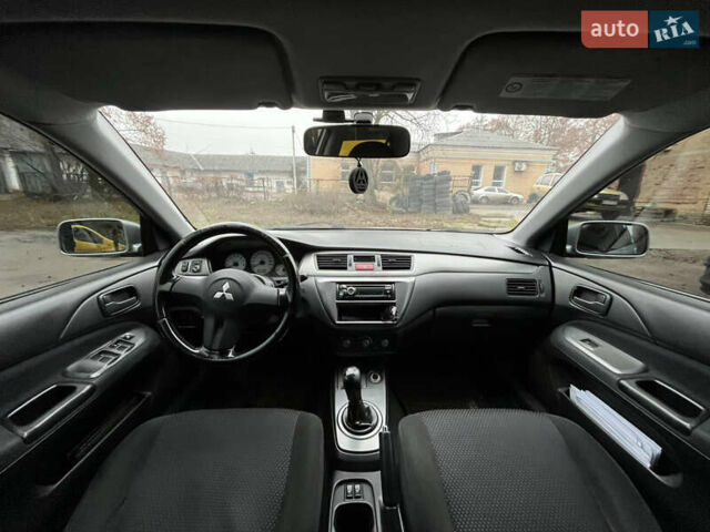 Сірий Міцубісі Lancer, об'ємом двигуна 1.58 л та пробігом 308 тис. км за 3700 $, фото 11 на Automoto.ua