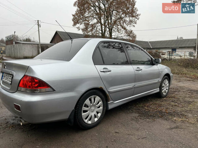 Сірий Міцубісі Lancer, об'ємом двигуна 1.58 л та пробігом 308 тис. км за 3700 $, фото 6 на Automoto.ua