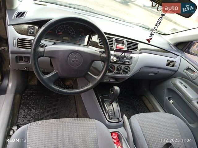 Сірий Міцубісі Lancer, об'ємом двигуна 2 л та пробігом 212 тис. км за 3333 $, фото 10 на Automoto.ua