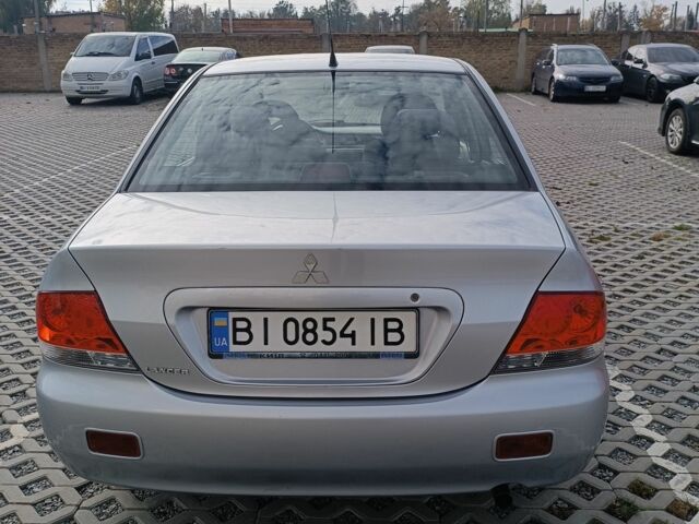 Сірий Міцубісі Lancer, об'ємом двигуна 1.6 л та пробігом 267 тис. км за 3600 $, фото 3 на Automoto.ua