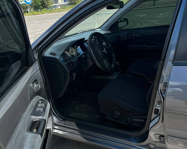 Сірий Міцубісі Lancer, об'ємом двигуна 1.6 л та пробігом 223 тис. км за 4500 $, фото 9 на Automoto.ua