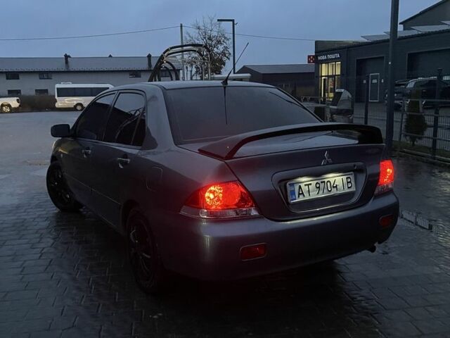 Серый Мицубиси Лансер, объемом двигателя 1.6 л и пробегом 213 тыс. км за 4450 $, фото 4 на Automoto.ua