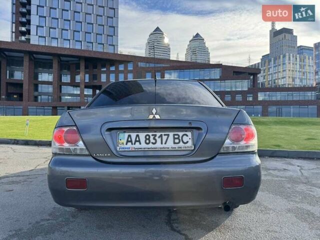 Сірий Міцубісі Lancer, об'ємом двигуна 1.58 л та пробігом 276 тис. км за 3650 $, фото 6 на Automoto.ua