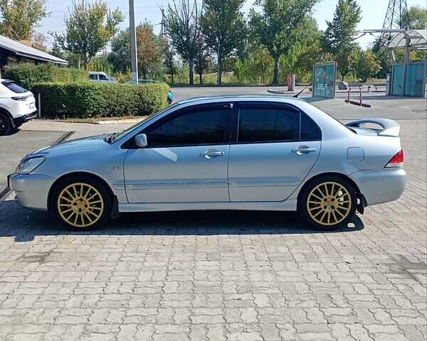 Сірий Міцубісі Lancer, об'ємом двигуна 1.58 л та пробігом 265 тис. км за 2900 $, фото 5 на Automoto.ua