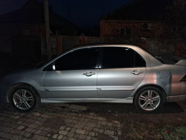 Сірий Міцубісі Lancer, об'ємом двигуна 2 л та пробігом 1000 тис. км за 3600 $, фото 4 на Automoto.ua