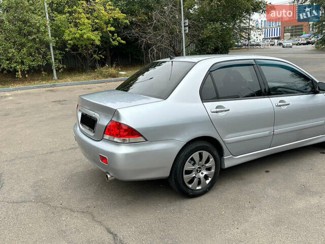 Серый Мицубиси Лансер, объемом двигателя 1.58 л и пробегом 183 тыс. км за 4800 $, фото 14 на Automoto.ua