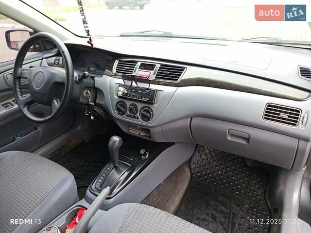 Сірий Міцубісі Lancer, об'ємом двигуна 2 л та пробігом 212 тис. км за 3333 $, фото 6 на Automoto.ua