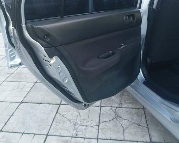 Мицубиси Лансер 2006 в Каменское - Днепродзержинск на Automoto.ua Серый Мицубиси Лансер, объемом двигателя 1.58 л и пробегом 238 тыс. км за 5400 $, фото 13 на Automoto.ua