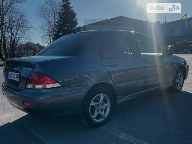 Сірий Міцубісі Lancer, об'ємом двигуна 1.6 л та пробігом 305 тис. км за 5200 $, фото 3 на Automoto.ua