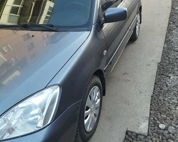 Сірий Міцубісі Lancer, об'ємом двигуна 1.58 л та пробігом 217 тис. км за 3500 $, фото 17 на Automoto.ua