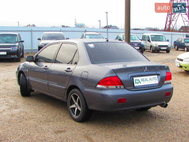 Серый Мицубиси Лансер, объемом двигателя 1.58 л и пробегом 300 тыс. км за 3600 $, фото 1 на Automoto.ua