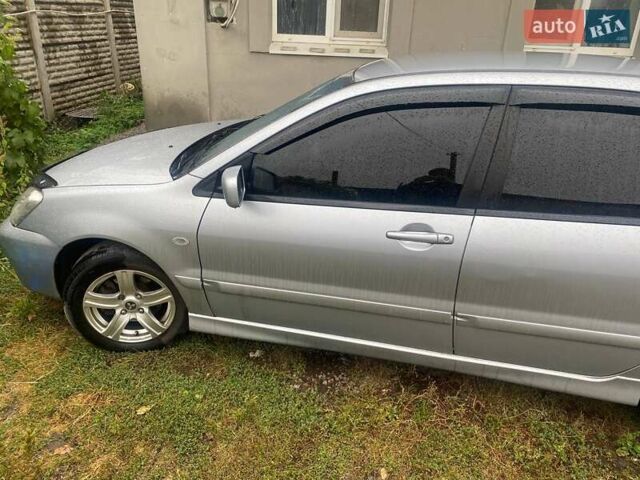 Сірий Міцубісі Lancer, об'ємом двигуна 1.58 л та пробігом 238 тис. км за 5000 $, фото 4 на Automoto.ua