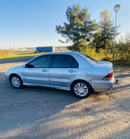 Серый Мицубиси Лансер, объемом двигателя 1.6 л и пробегом 253 тыс. км за 2350 $, фото 3 на Automoto.ua