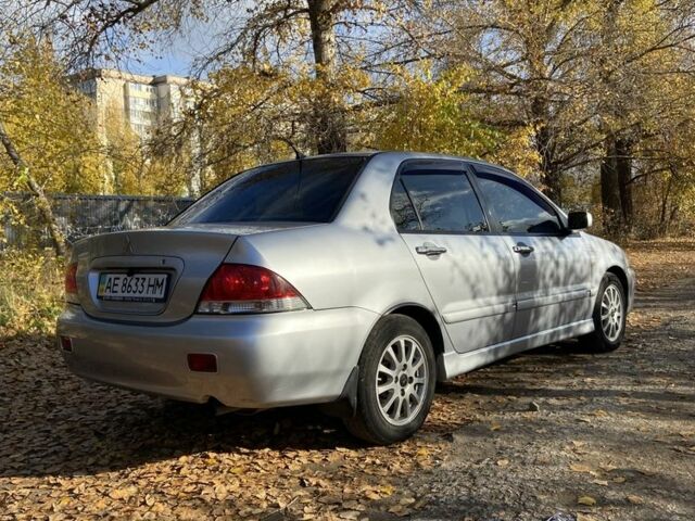 Серый Мицубиси Лансер, объемом двигателя 1.6 л и пробегом 204 тыс. км за 3999 $, фото 4 на Automoto.ua