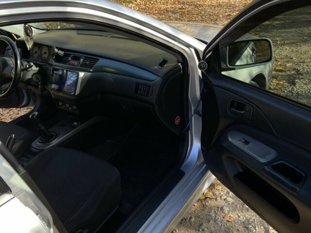 Серый Мицубиси Лансер, объемом двигателя 1.6 л и пробегом 204 тыс. км за 3999 $, фото 12 на Automoto.ua