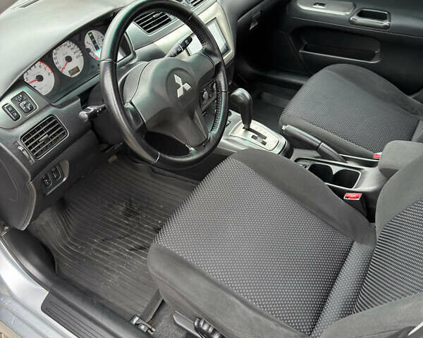Міцубісі Lancer 2006 у Житомирі на Automoto.ua Сірий Міцубісі Lancer, об'ємом двигуна 1.58 л та пробігом 195 тис. км за 4999 $, фото 12 на Automoto.ua
