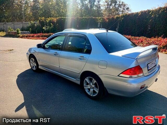 Сірий Міцубісі Lancer, об'ємом двигуна 1.6 л та пробігом 226 тис. км за 4000 $, фото 1 на Automoto.ua