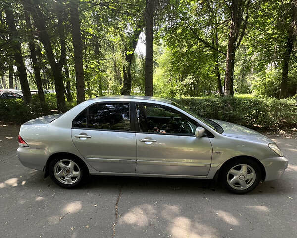 Сірий Міцубісі Lancer, об'ємом двигуна 1.6 л та пробігом 331 тис. км за 3100 $, фото 2 на Automoto.ua