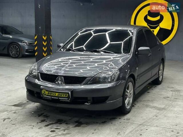 Серый Мицубиси Лансер, объемом двигателя 1.58 л и пробегом 300 тыс. км за 4600 $, фото 2 на Automoto.ua