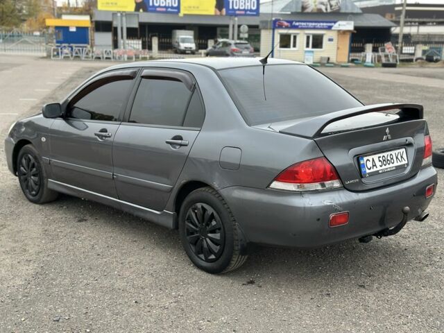 Серый Мицубиси Лансер, объемом двигателя 1.6 л и пробегом 250 тыс. км за 2550 $, фото 5 на Automoto.ua