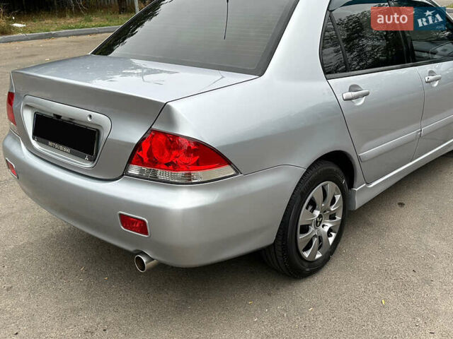 Серый Мицубиси Лансер, объемом двигателя 1.58 л и пробегом 183 тыс. км за 4800 $, фото 11 на Automoto.ua