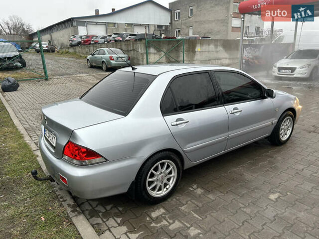 Сірий Міцубісі Lancer, об'ємом двигуна 1.6 л та пробігом 223 тис. км за 3900 $, фото 4 на Automoto.ua