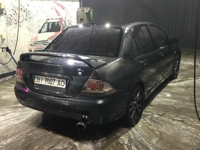 Міцубісі Lancer 2006 у Синельниковом на Automoto.ua Сірий Міцубісі Lancer, об'ємом двигуна 2 л та пробігом 200 тис. км за 3000 $, фото 7 на Automoto.ua
