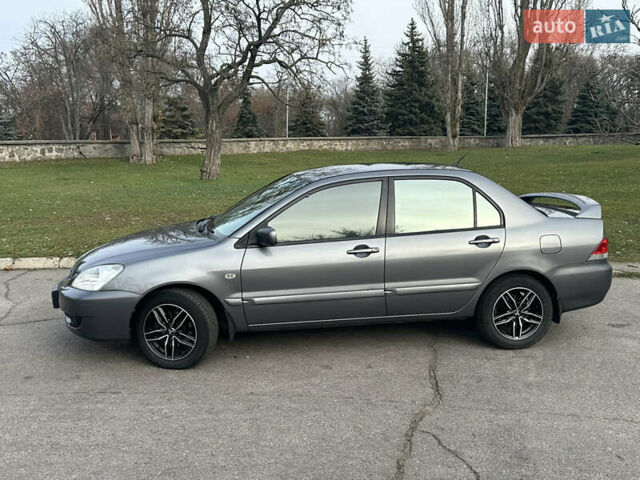 Сірий Міцубісі Lancer, об'ємом двигуна 1.58 л та пробігом 332 тис. км за 4650 $, фото 2 на Automoto.ua