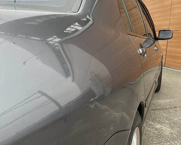Сірий Міцубісі Lancer, об'ємом двигуна 1.6 л та пробігом 260 тис. км за 4998 $, фото 25 на Automoto.ua