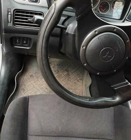 Серый Мицубиси Лансер, объемом двигателя 2 л и пробегом 284 тыс. км за 4100 $, фото 4 на Automoto.ua